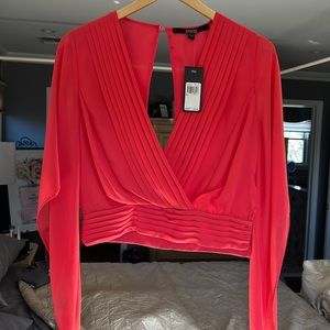 Guess coral colored short waisted blouse